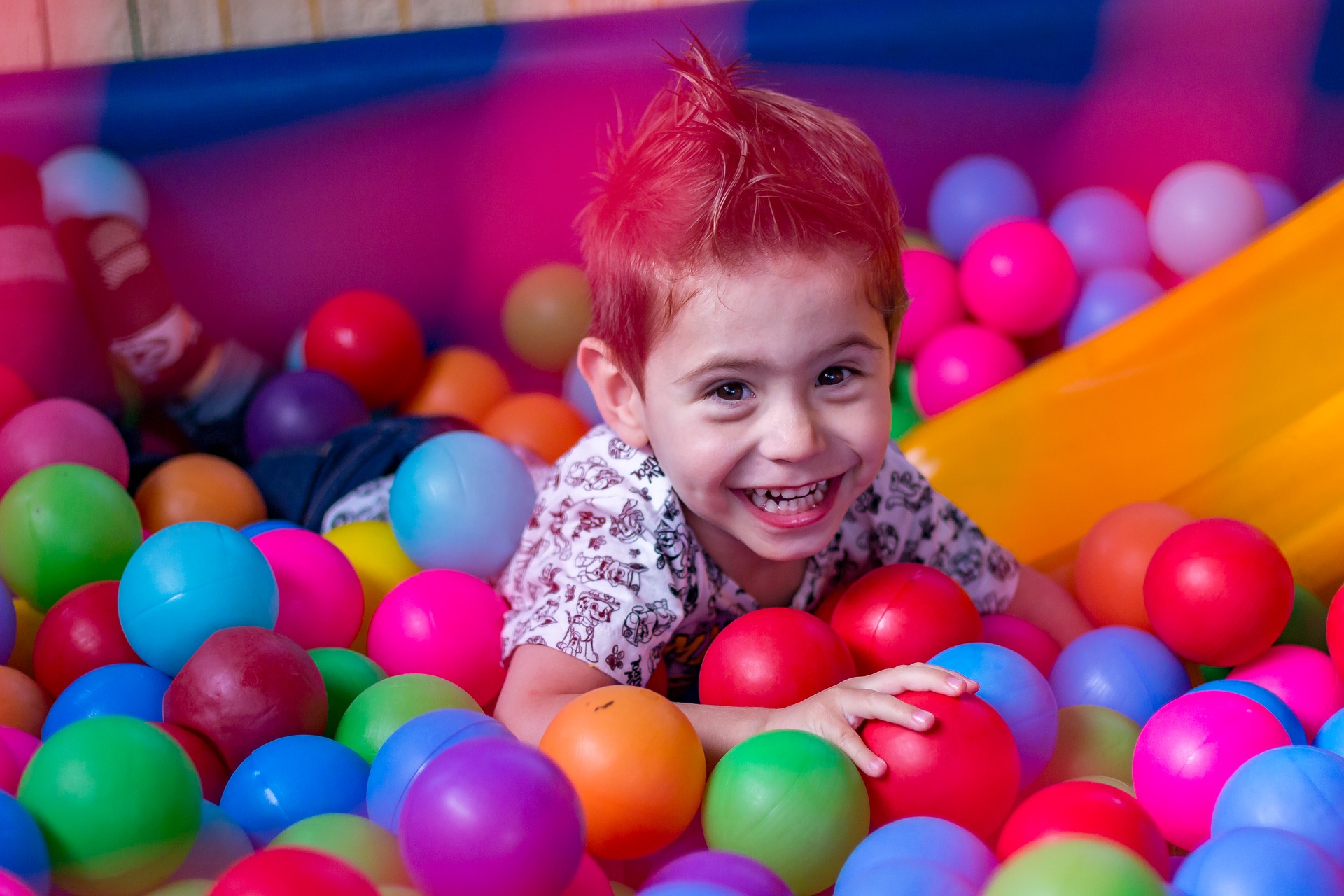 Child in ball pool